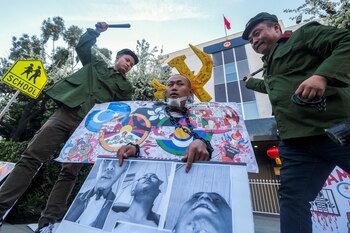 Demonstrators acting as Chinese police