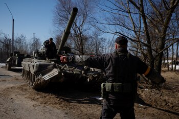 A Ukrainian soldier directs a