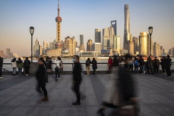Visitors walk on the Bund