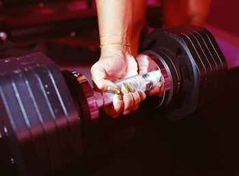 NYTSELECTS Ñ A patron lifts weights at Tension, a womenÕs-only strength-training gym in the in Williamsburg neighborhood of Brooklyn on Saturday, Sept. 26, 2026. Owner Kristie Larson says she opened Tension after always tiring of always feeling like a ÒguestÓ in male-dominated lifting gyms. (Marissa Alper/The New York Times)