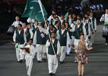 Pakistan's flagbearer Sohail Abbas (C)