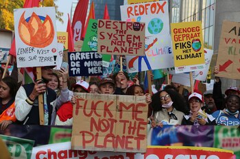 Protesters take part in a demonstration against climate change in Brussels, on October 10, 2021, ahead of the COP26 climate summit. - The COP26 climate summit is held from October 31 to November 12, 2021. (Photo by NICOLAS MAETERLINCK / BELGA / AFP) / Belgium OUT