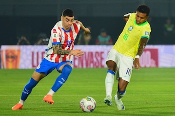 Paraguay's midfielder Miguel Almiron (L)