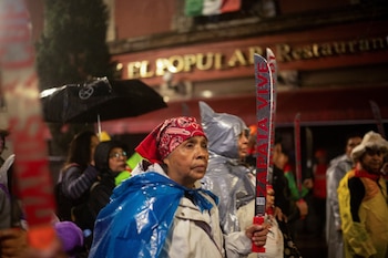 People from Atenco hold machetes as they protest to demand justice in the 2014 disappearance of 43 student teachers from the Ayotzinapa Rural Teachers' College, in Mexico City, Mexico September 26, 2024. REUTERS/Quetzalli Nicte-Ha