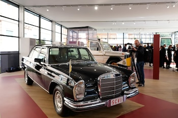 A popemobile used by successive popes is displayed at "A Century of the Popemobile," an exhibition tracing 100 years of papal transportation, from Pope Pius XI's first automobile in 1930 to modern popemobiles, at the Vatican Museums