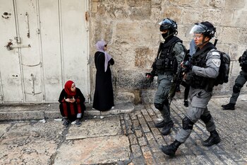 Israeli security personnel patrol an