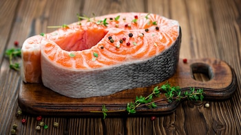 Salmon fish steak on wooden