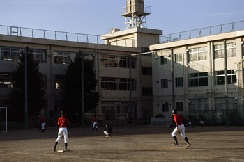 Boys practice baseball at a middle school in Tokyo on April 23, 2021. The Tokyo Olympics offer a chance to crown a new set of heroes to inspire budding female athletes. (Noriko Hayashi/The New York Times)