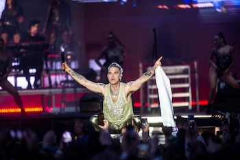 El cantante británico Robbie Williams encabeza la cartelera del festival y se presentará en el escenario principal a las 22:45 horas. Ritzau Scanpix/via REUTERS