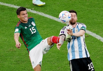 Soccer Football - FIFA World Cup Qatar 2022 - Group C - Argentina v Mexico - Lusail Stadium, Lusail, Qatar - November 26, 2022 Mexico's Hector Moreno in action with Argentina's Lionel Messi REUTERS/Molly Darlington