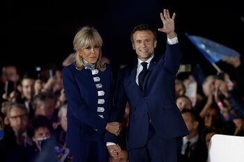 French President Emmanuel Macron waves