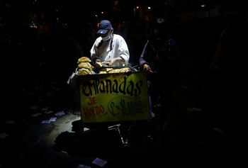 A man sells empanadas while