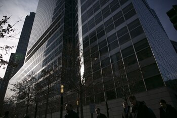 Pedestrians pass in front of