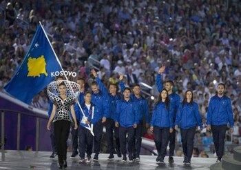 Members of Kosovo's delegation parade