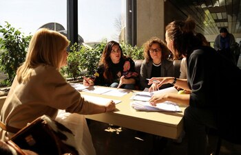 Staff members prepare a program