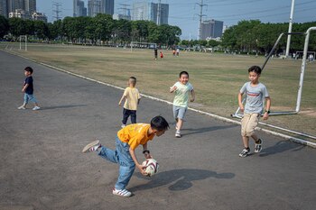 Children play soccer in Humen