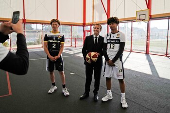 French President Emmanuel Macron poses