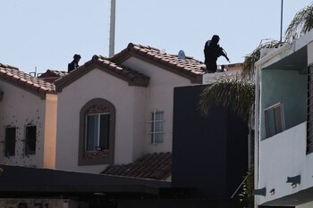 Members of security forces work