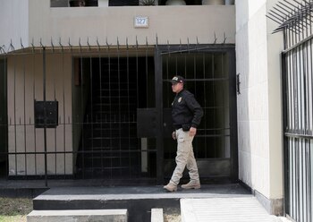 A police officer stands guard
