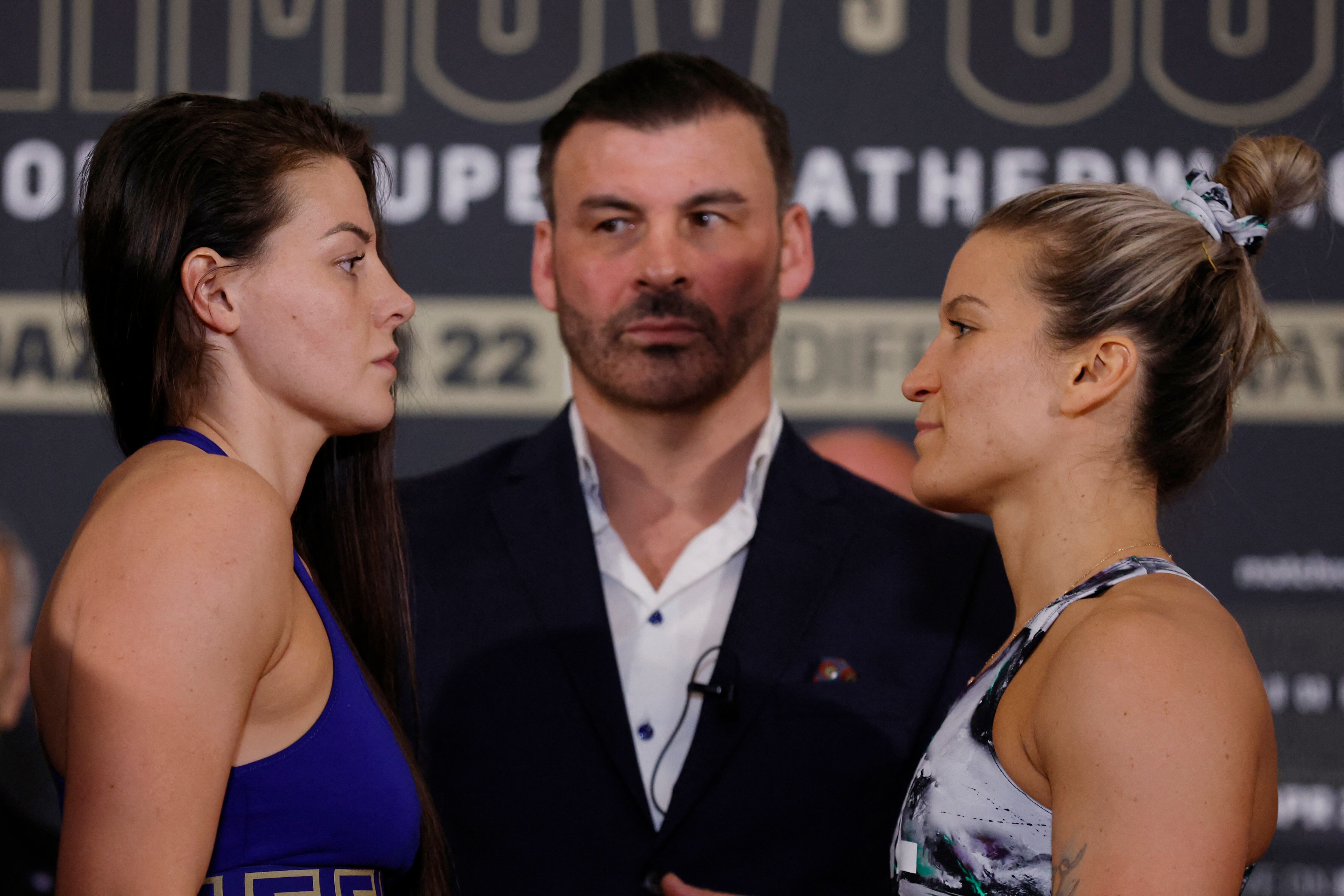 Boxing - IBF World Super Featherweight Title - Shavkatdzhon Rakhimov v Joe Cordina Weigh-in - Cardiff City Hall, Cardiff, Wales, Britain - April 22, 2023 Sandy Ryan poses during the weigh-in with Marie-Pier Houle as former boxer Joe Calzaghe looks on Action Images via Reuters/Andrew Couldridge