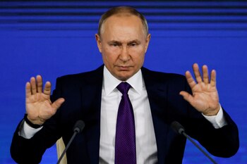 Russian President Vladimir Putin gestures