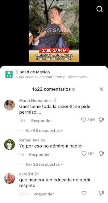 Captura de pantalla de un video muestra a Gael García Bernal con una camiseta oscura, extendiendo una mano hacia adelante para detenerse, en un entorno con plantas