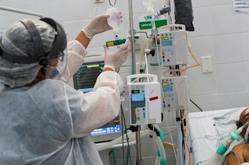A medical worker administers medication