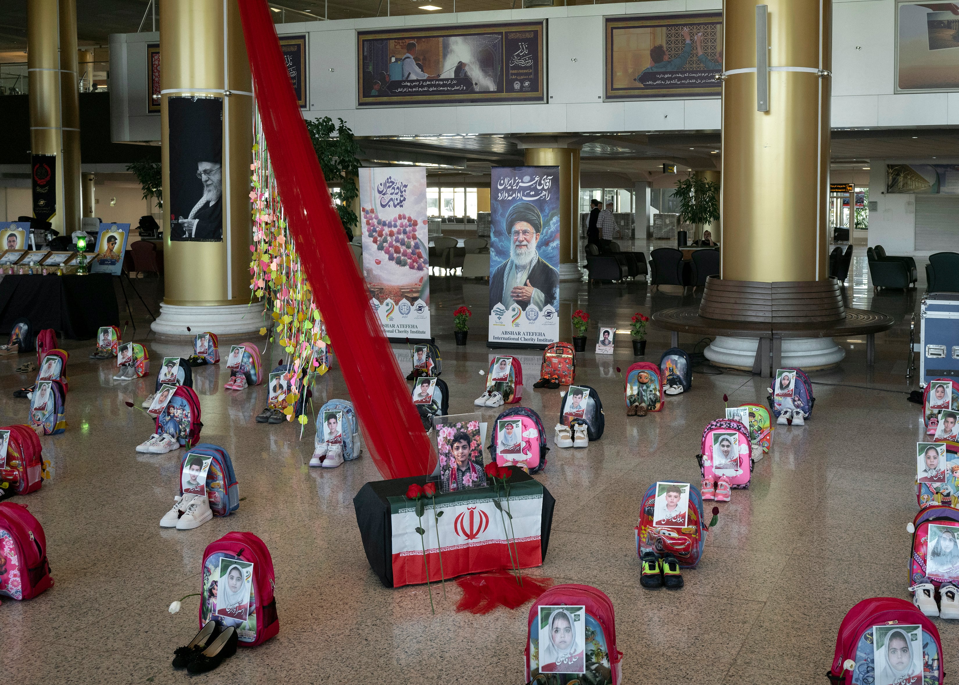 FILE Ñ A display commemorating the deaths of children in an airstrike on an elementary school is seen on Wednesday, July 8, 2026, at the airport in Mashad, Iran. United Nations investigators said on Thursday, Sept. 17, 2026, that there were reasonable grounds to conclude that two U.S. airstrikes on Iran in February in which at least 178 civilians died had been indiscriminate and amounted to war crimes. (Emile Ducke/The New York Times)