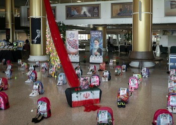 FILE Ñ A display commemorating the deaths of children in an airstrike on an elementary school is seen on Wednesday, July 8, 2026, at the airport in Mashad, Iran. United Nations investigators said on Thursday, Sept. 17, 2026, that there were reasonable grounds to conclude that two U.S. airstrikes on Iran in February in which at least 178 civilians died had been indiscriminate and amounted to war crimes. (Emile Ducke/The New York Times)