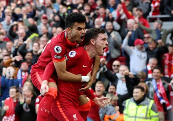 Soccer Football - Premier League - Liverpool v Everton - Anfield, Liverpool, Britain - April 24, 2022 Liverpool's Andrew Robertson celebrates scoring their first goal with Luis Diaz REUTERS/Phil Noble EDITORIAL USE ONLY. No use with unauthorized audio, video, data, fixture lists, club/league logos or 'live' services. Online in-match use limited to 75 images, no video emulation. No use in betting, games or single club /league/player publications. Please contact your account representative for further details.