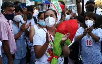 Together for Peru presidential candidate Veronika Mendoza applauds during a campaign rally in the San Juan de Lurigancho neighborhood of Lima, Peru, Thursday, March 25, 2021. Peru's general election is set for April 11. (AP Photo/Martin Mejia)
