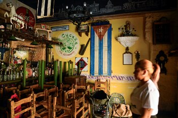 A woman enters the Cucana