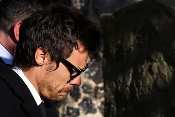 Harry Styles arrives to attend