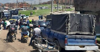 Fila de carros generada por