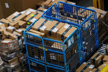 FILE PHOTO: Packages are seen inside Amazon's JFK8 distribution center in Staten Island, New York, U.S. November 25, 2020. REUTERS/Brendan McDermid/