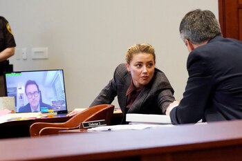 Actor Amber Heard talks to