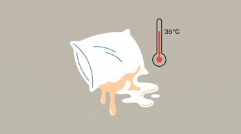 Una almohada blanca se derrite y de ella brota un líquido color durazno, junto a un termómetro de mercurio que señala 35 grados Celsius.
