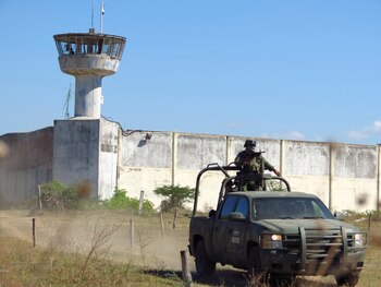 Soldiers patrol the perimeter of the Cereso prison, where inmates were injured and killed during a riot, in Colima, Mexico January 25, 2022. REUTERS/Stringer NO RESALES. NO ARCHIVES