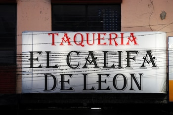 The sign of the Taqueria El Califa de Leon, which recently earned one star in the Michelin Guide, as seen from the street in Mexico City, Mexico, May 16, 2024. REUTERS/Gustavo Graf