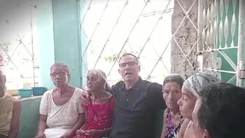 José Daniel Ferrer junto a