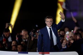 French President Emmanuel Macron waves