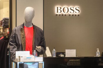 A mannequin stands next to