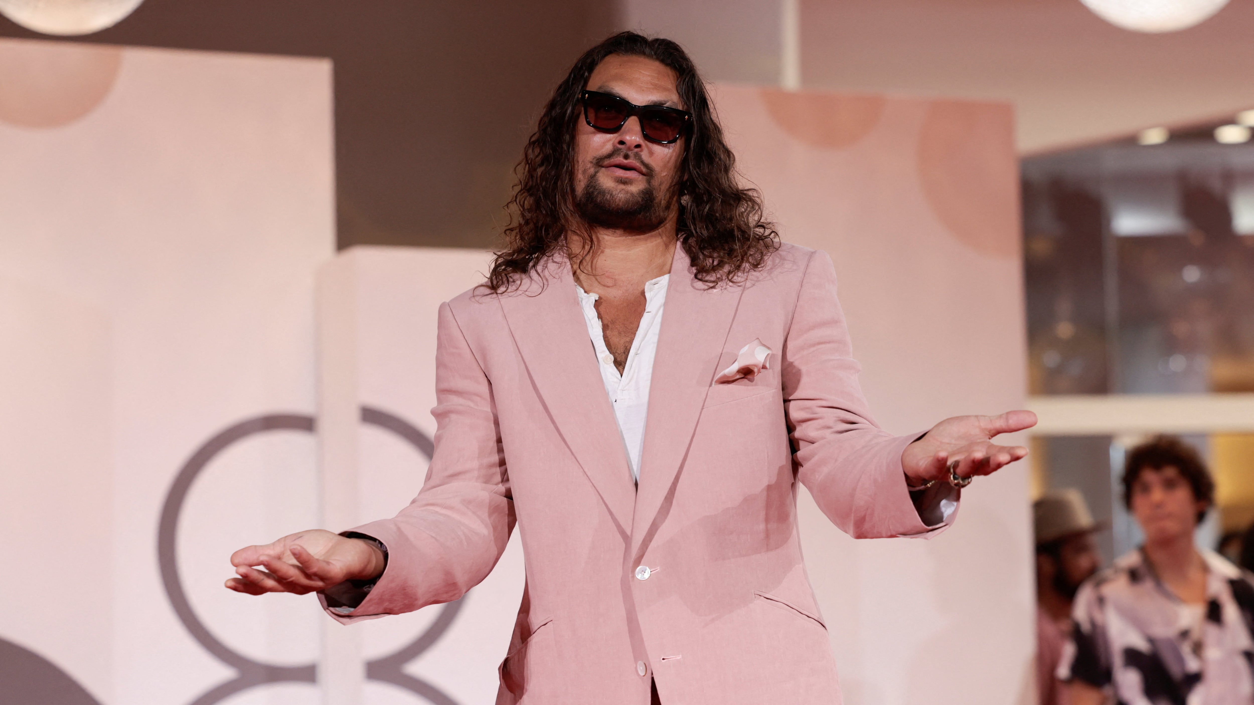 Cast member Jason Momoa poses on the red carpet during arrivals for the screening of the movie