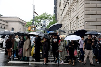 People gather outside the Metropolitan