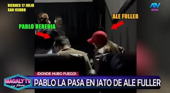 Dos personas sentadas en una sala oscura, una con gorra roja. Texto en pantalla: Pablo Heredia, Ale Fuller, viernes 17 julio San Isidro, Magaly TV