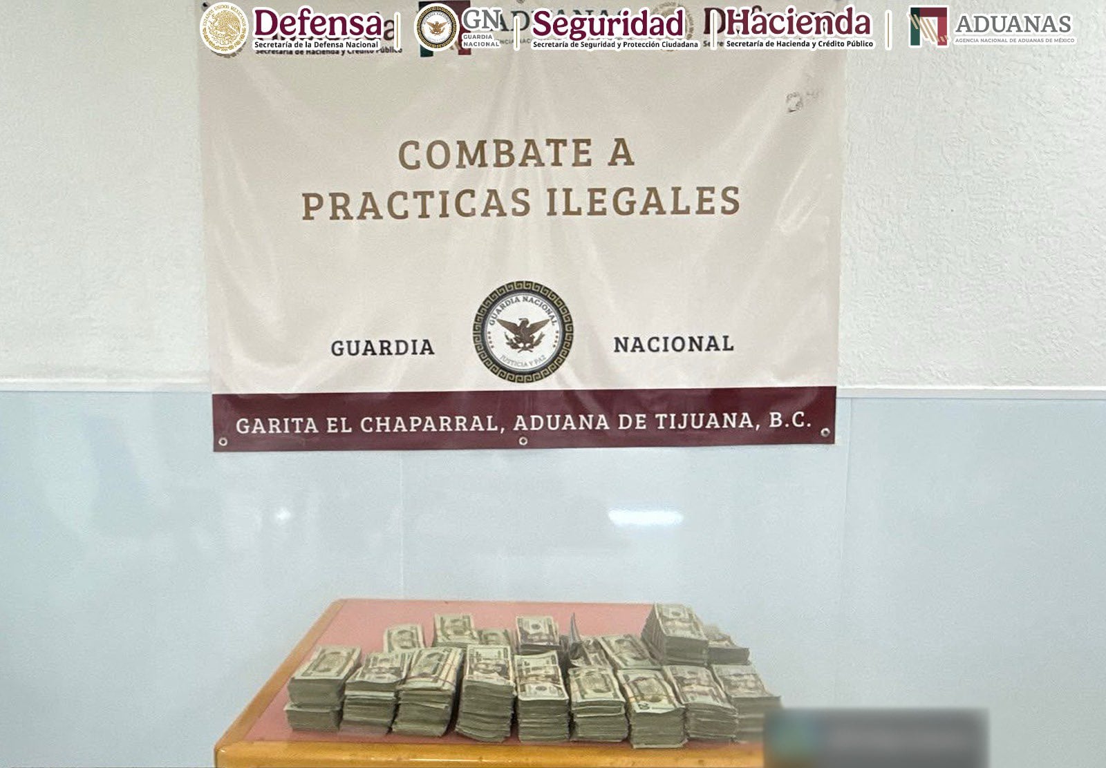 Dólares asegurados en Tijuana. Crédito: Gabinete de Seguridad