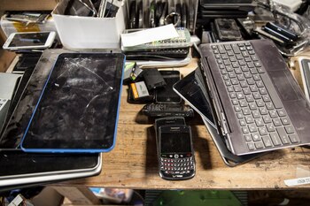 FILE — A recycling technician’s