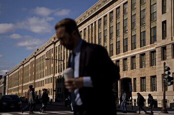 A pedestrian walks near the