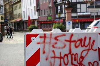 Graffiti reading 'Stay Home' on