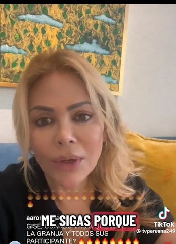 Primer plano de Gisela Valcárcel, mujer rubia, hablando a cámara. Viste ropa oscura, fondo con cuadro abstracto amarillo y verde. Hay textos superpuestos y logo de TikTok